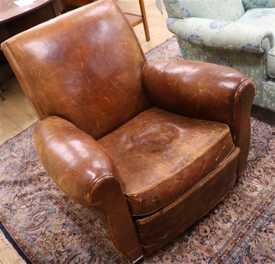 A 1930s French leather club armchair